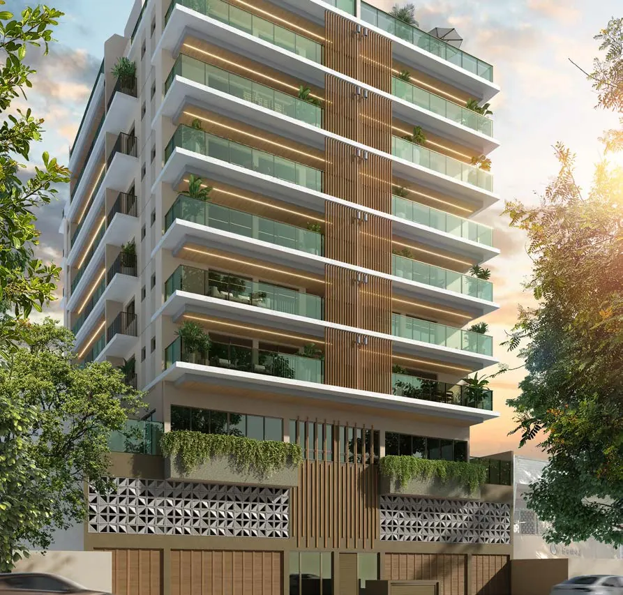 Fachada do Dom Park Residencial ao entardecer, com varandas de vidro, frisos de luz e ripado de madeira na Rua Araújo Pena, Tijuca
